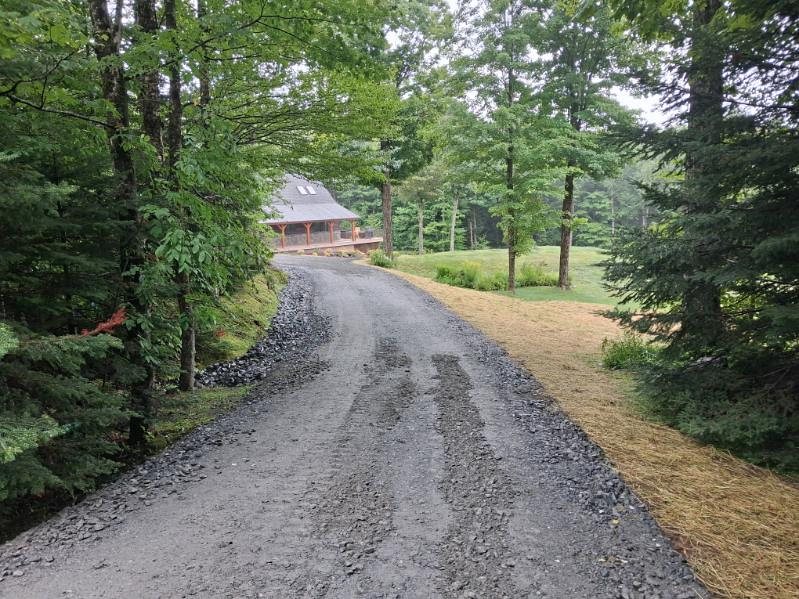 Drive cut through the woods