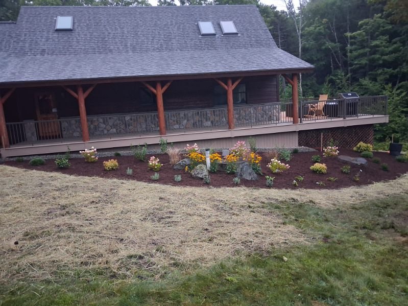 Beds planted along the porch