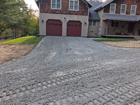 Gravel drive laid to the garage doors