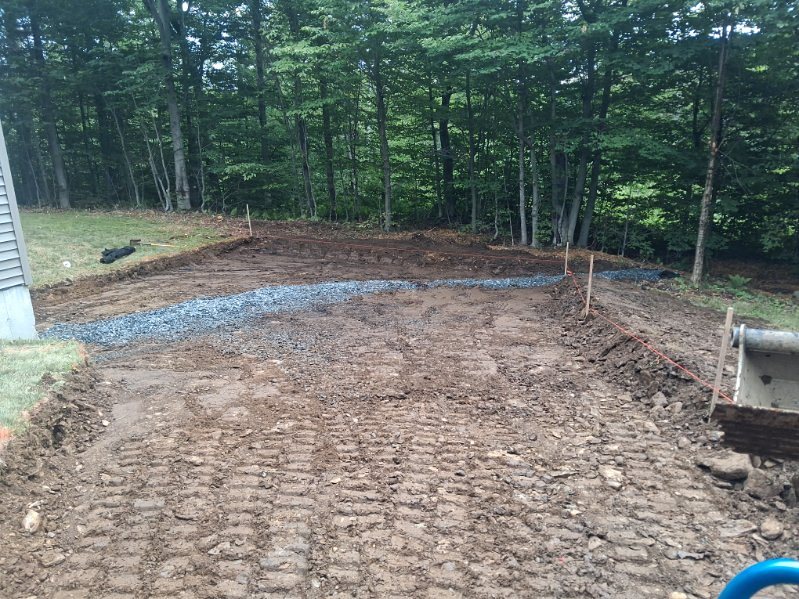 Trench backfilled with drainage stone
